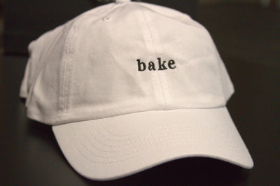 White dad hat with bake logo 