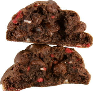 A chocolate peppermint chip cookie opened up to reveal layers of gooey chocolate and crunchy andes peppermint chips inside. The perfect indulgence for the holiday season.