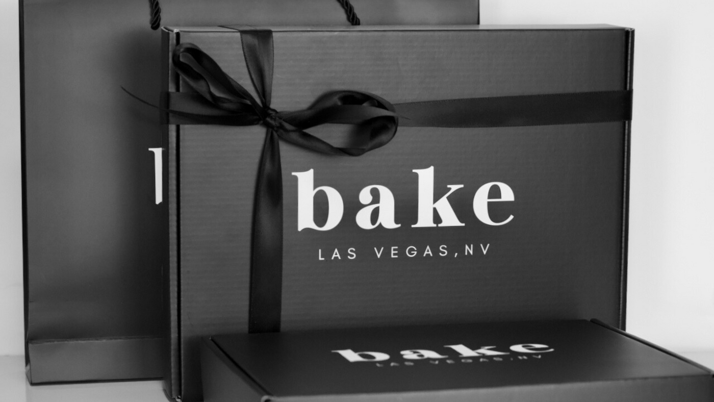 the bake bag and box packaging with black ribbon and bake logos
