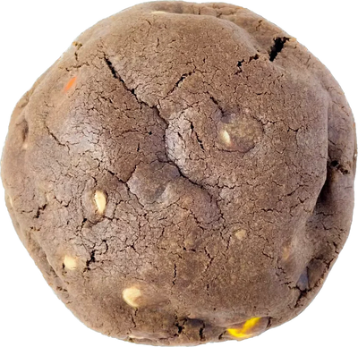 A close-up of a chocolate peanut butter chip cookie, bursting with creamy peanut butter flavor and crunchy Reese's Pieces.