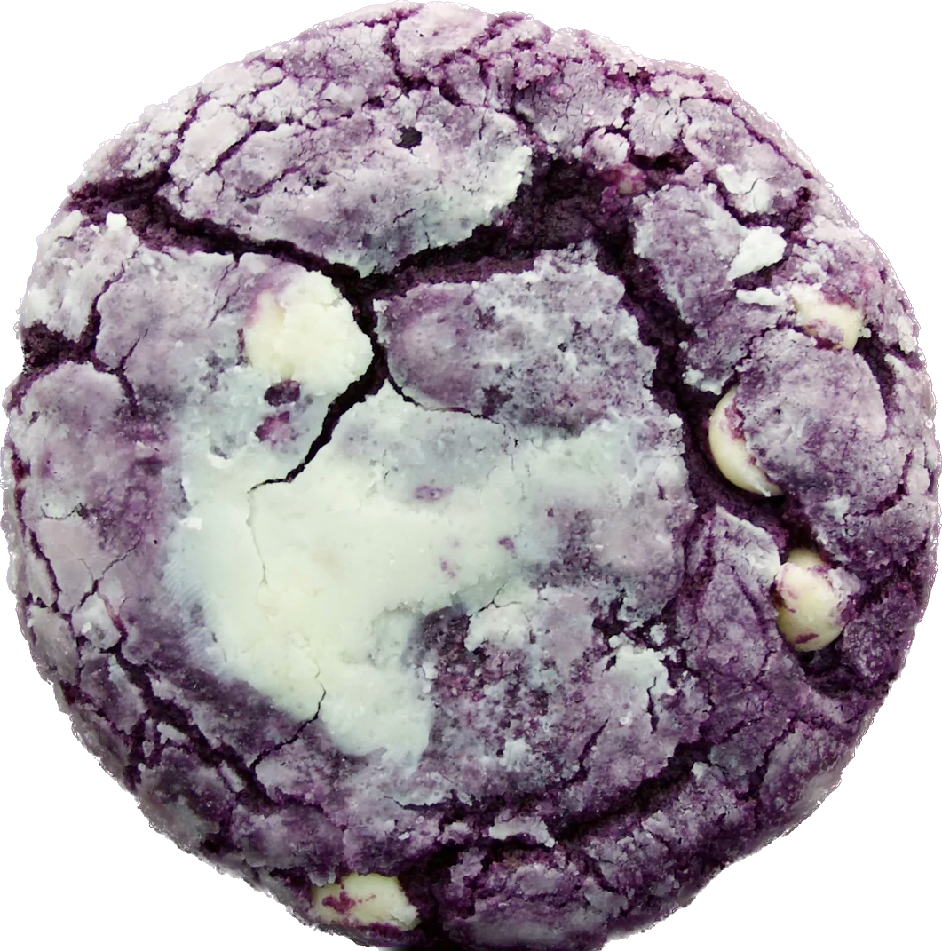 A close-up of a single ube crinkle cookie from Bake the Cookie Shoppe, dusted with powdered sugar